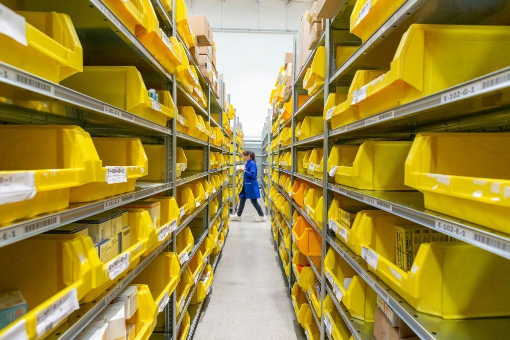 Worker between picking racks